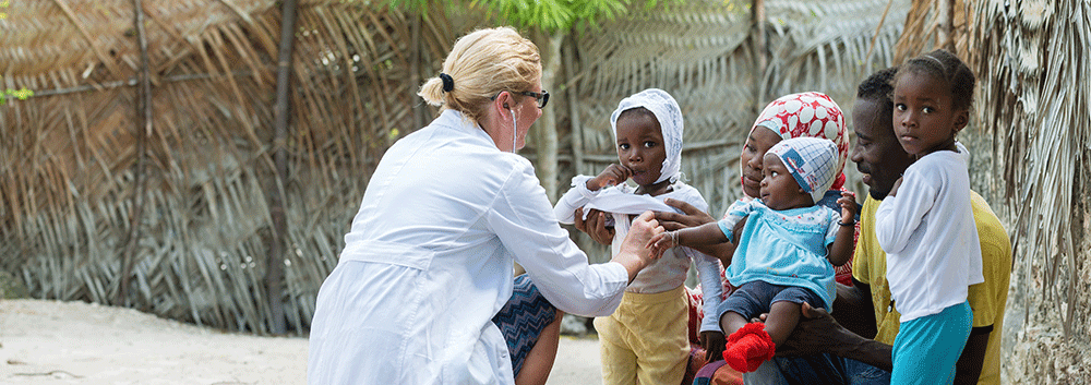 Women Doctor Aiding children in rural village